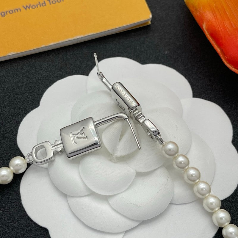 18K Louis Vuitton Pearl Lock Gold Earrings